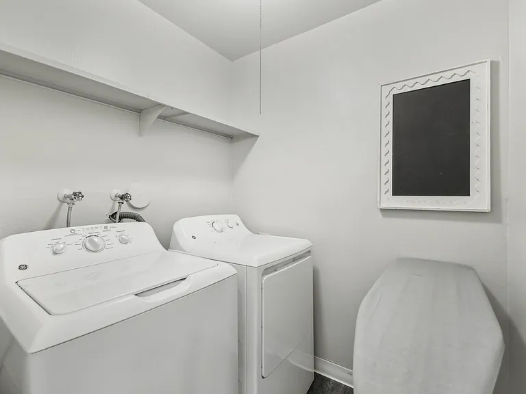 In unit laundry room with washer and dryer