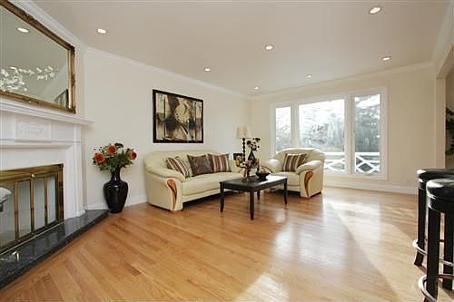 West-facing living room with wood-burning fireplace