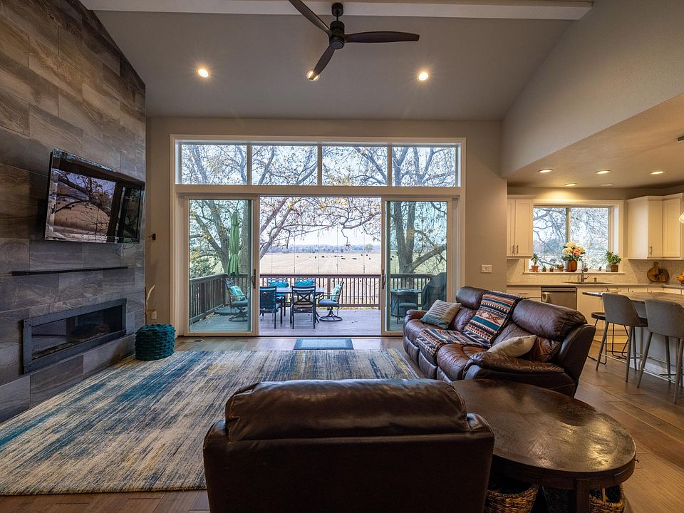 Open Floor Plan, Living/Dining/Kitchen with amazing views, beautiful fireplace, and amazing kitchen.