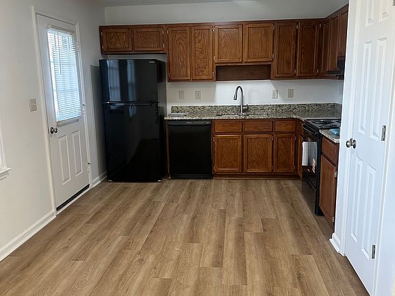 Kitchen with all new appliances, hood vent, granite counter tops, refinished cabinets, new flooring