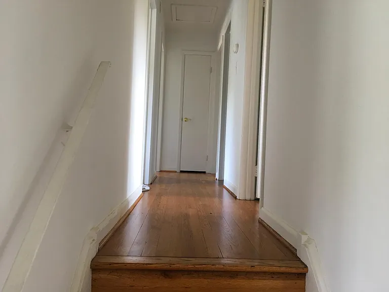 hallway to the four bedrooms upstairs