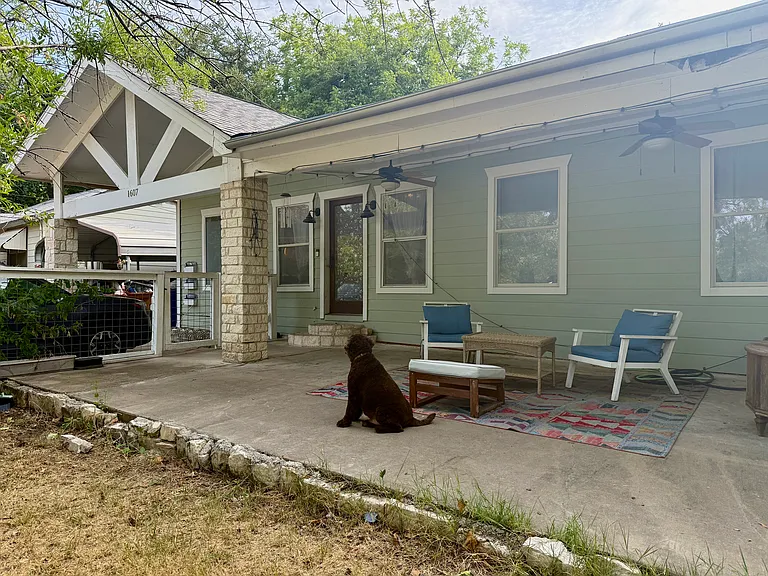 The lovely front porch, ready for you to relax, read or host friends. Furniture comes with the porch but can be stored around the corner if not desired.
Labradoodle not included :)