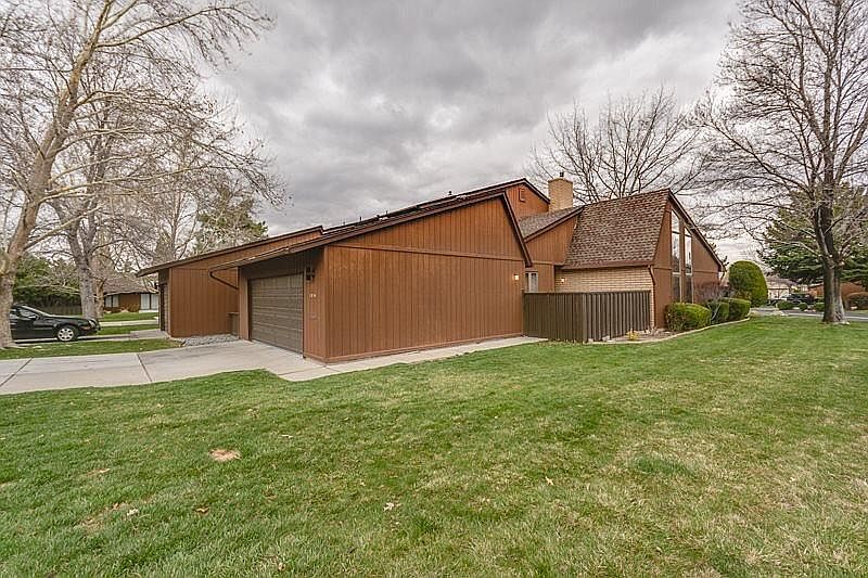 Exterior with front private courtyard and rear patio.