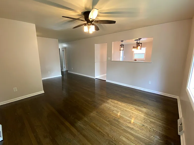 Nice main Living room with new fan and lights.
