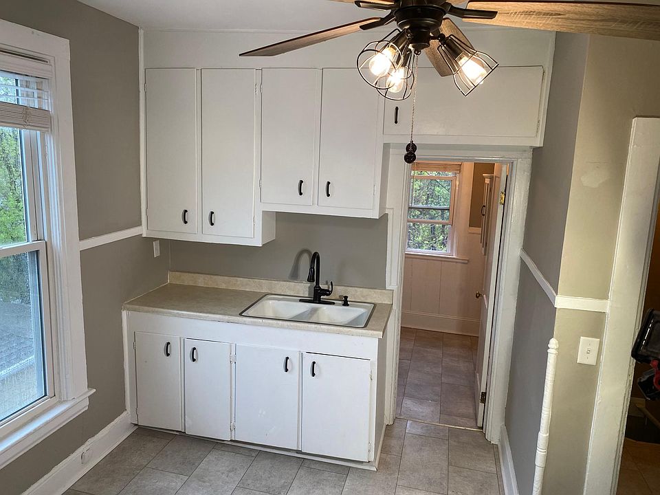 Kitchen with bathroom door