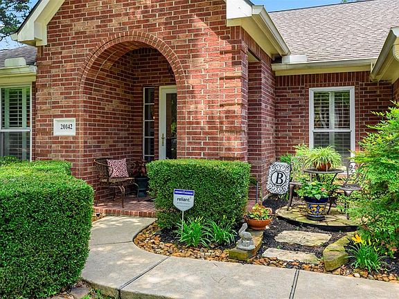 A charming walkway and quaint courtyard area welcome all visitors.