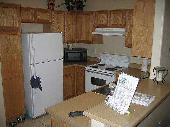 Kitchen has skylight, tile floor