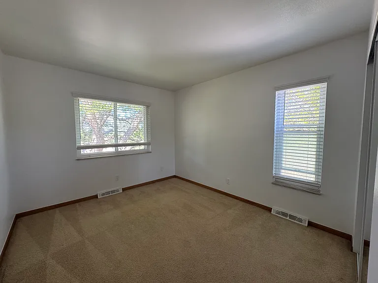 Main level Bedroom #1 shade tree and new blinds on all windows on the main level