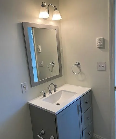 Bathroom with new cabinet and mirror