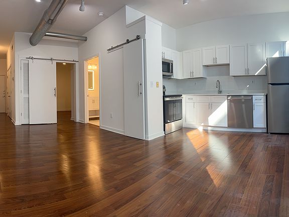 Living room and kitchen - granite countertops and new appliances