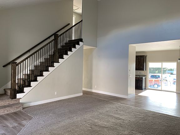Living room with stairs going up