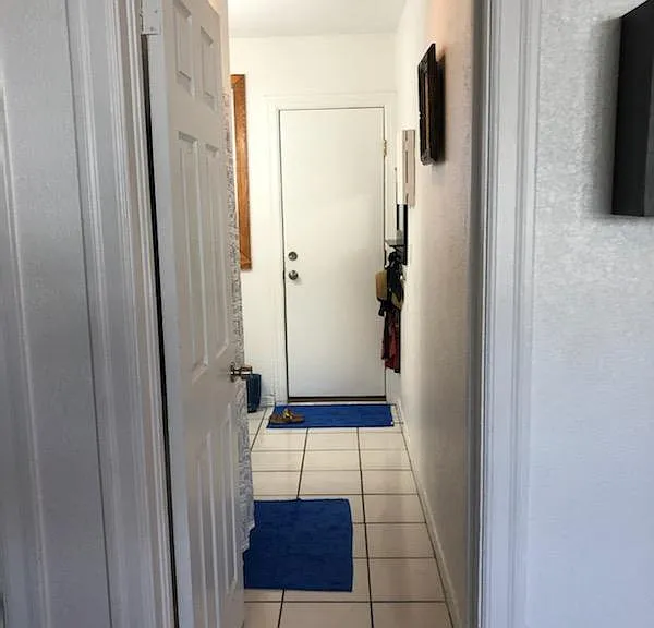 LIVING ROOM THROUGH BATH TO REAR ENTRY