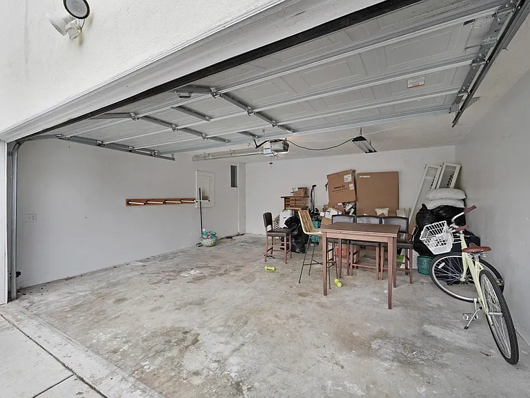 This garage is shared. Have to the bottom unit, have to the top unit with the option to then park your vehicle in tandem, on in and one out.