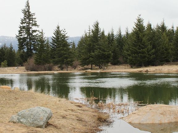 Lake Ann sits directly in front of this site.