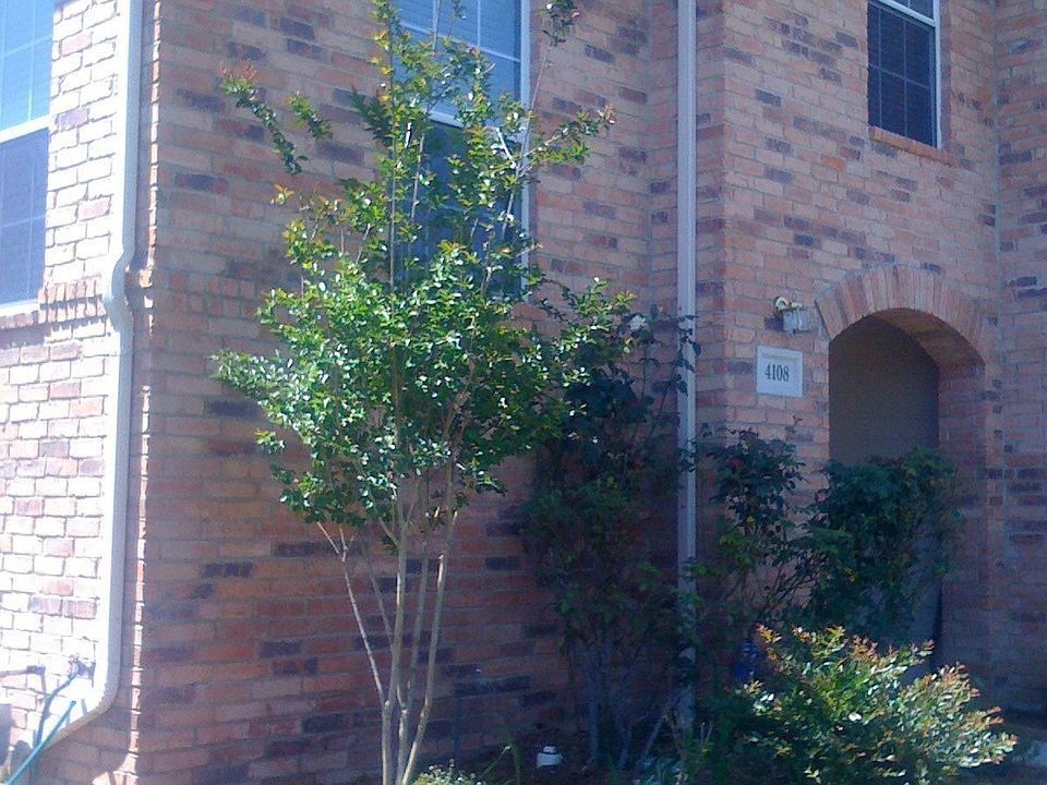 Crape myrtles and roses in front garden