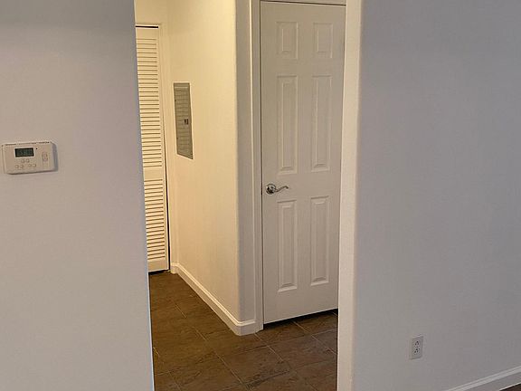 Hallway to second bedroom, 2 hall closets, washer/dryer/storage area, and bathroom.