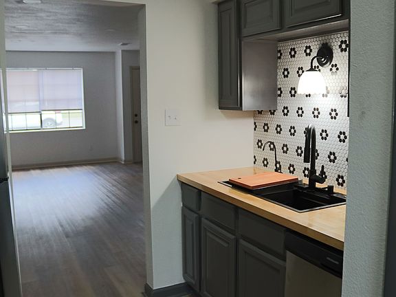 Kitchen opens up to large living/dining area