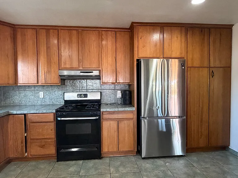 The kitchen features new light fixture and outlets.