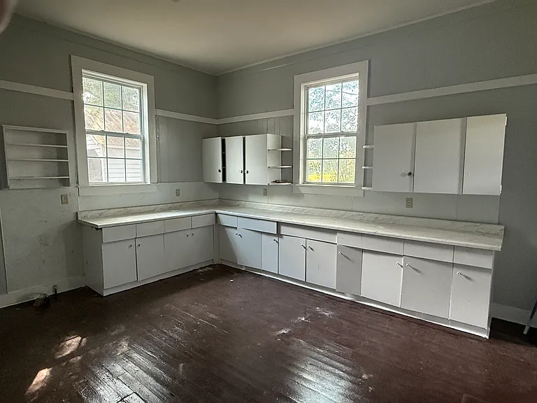 Kitchen with lots of counter and cabinet space. dishwasher, Frig, and stove with hood