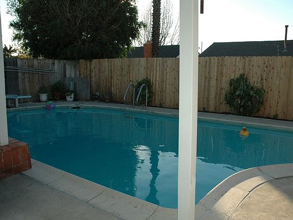Great backyard with a pool for those hot summer days. New fence as well