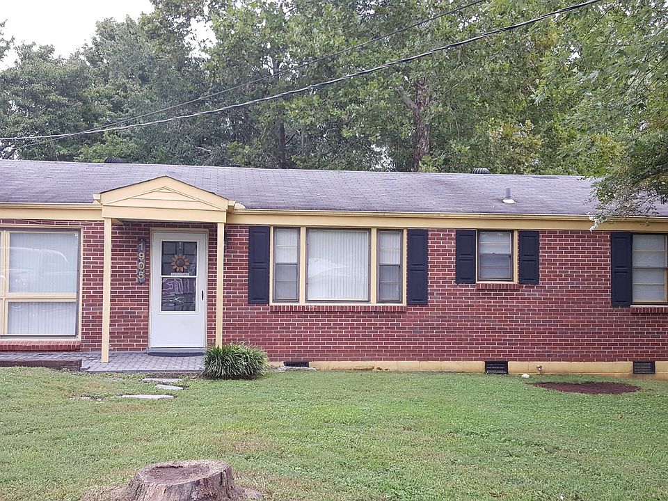Welcome Home! A brand new metal roof is being put on in two weeks and all of the trim is being painted black!