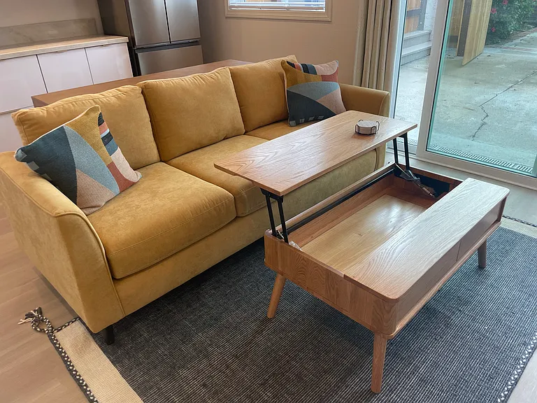 Convertible coffee table to ergonomic comfort level for computer use.