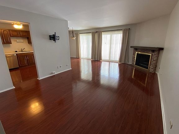 Living Room with beautiful Brazilian Hickory plank flooring and Fireplace