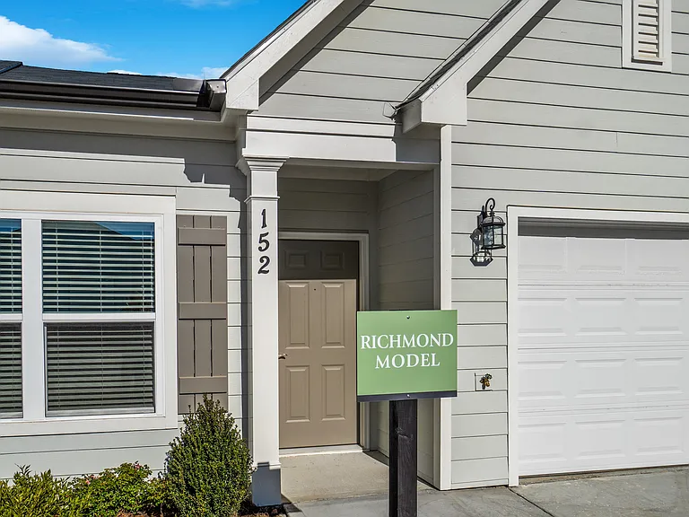 Exterior of the Richmond layout, showcasing the front porch and attached garage.