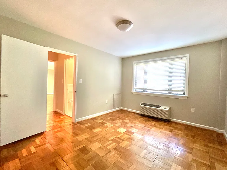Bedroom looking at entrance from the bathroom hall