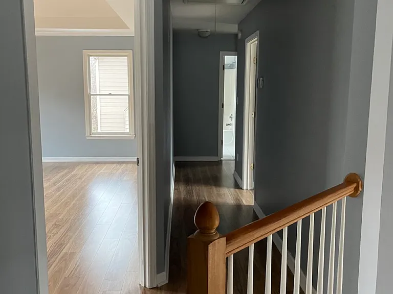Upstair hallway and a peek of master bedroom.