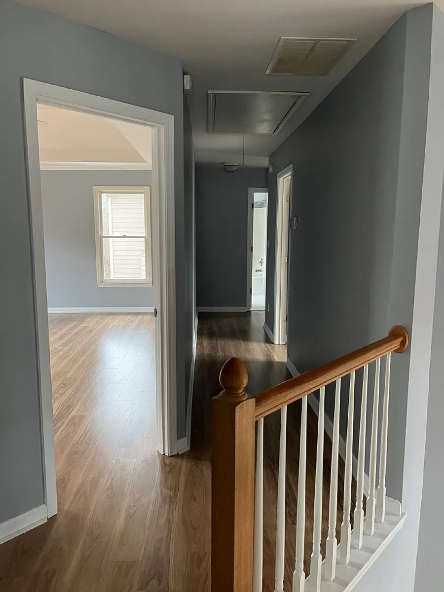Upstair hallway and a peek of master bedroom. - 895 River Overlook Dr