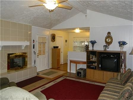 Big den with high ceiling is open to the breakfast