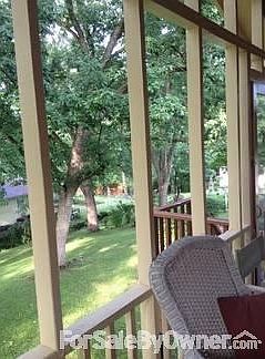 Covered deck with mature treed lot
						:
						Newly painted deck - deck furniture included with home