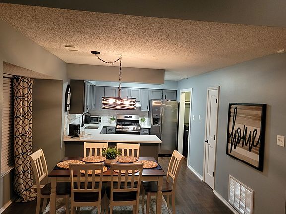 The updated kitchen offers new matching stainless appliances, new light fixtures, sink, cabinets & quartz countertops.
