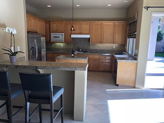 Big Open kitchen leads to family room and out to pool