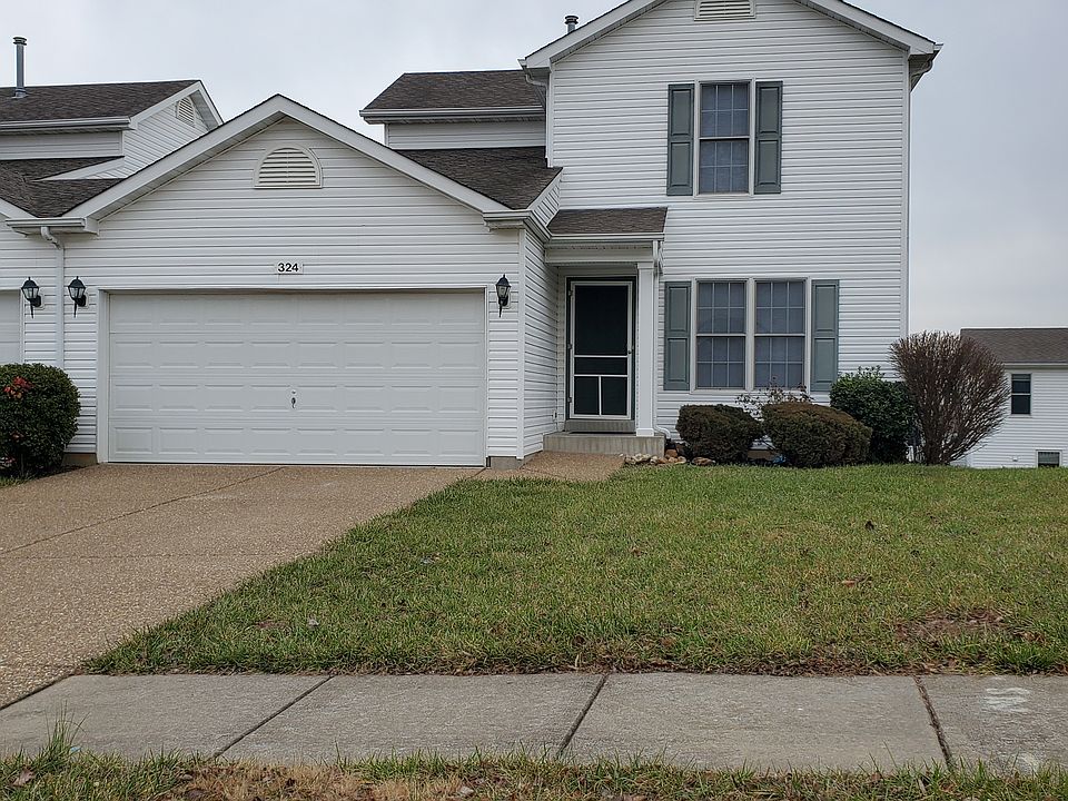 Front view of unit with a 2 car garage.