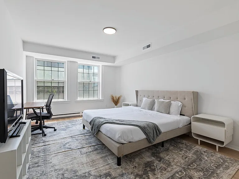 Unit #301 - oversized primary bedroom with tons of natural light