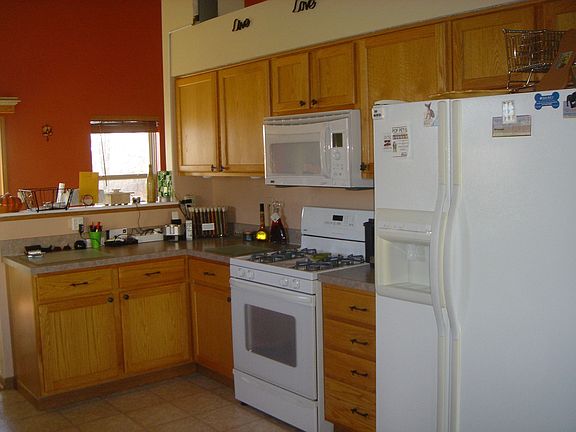 Kitchen ample counter and cabinet space.  All white appliances to stay.