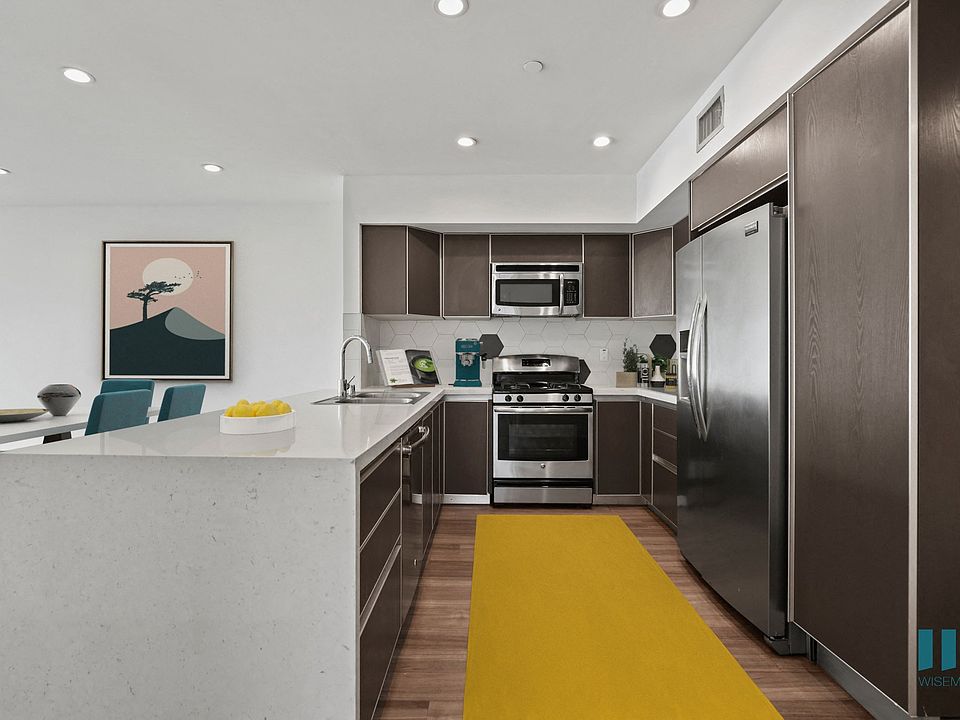 Open-Concept Kitchen with Energy-Efficient Appliances and Countertop Bar