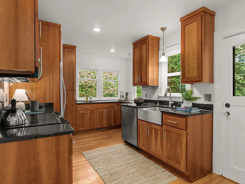 Kitchen with cherry cabinets, granite countertops and updated appliances for those that love to cook.