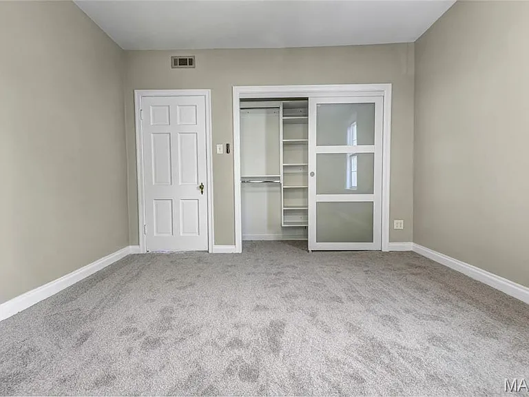 Lighted custom closets in both bedrooms.