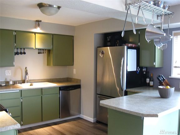 The updated kitchen boasts numerous storage areas and work stations - perfect for whipping up your favorite delights!  Visitors 