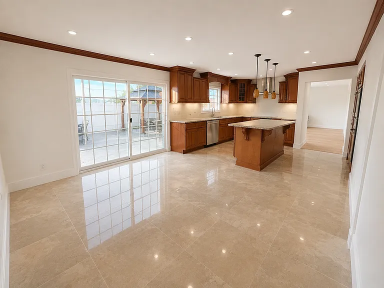 Large and bright Kitchen and Dinning area with stainless steel appliances.