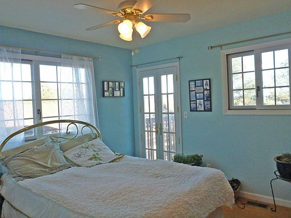 MAIN LEVEL MASTER BEDROOM WITH WALKOUT TO DECK