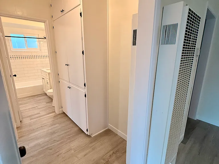 Spacious Linen Closet with New Rubbed Bronze Hardware, New Light Fixtures with Edison Bulbs