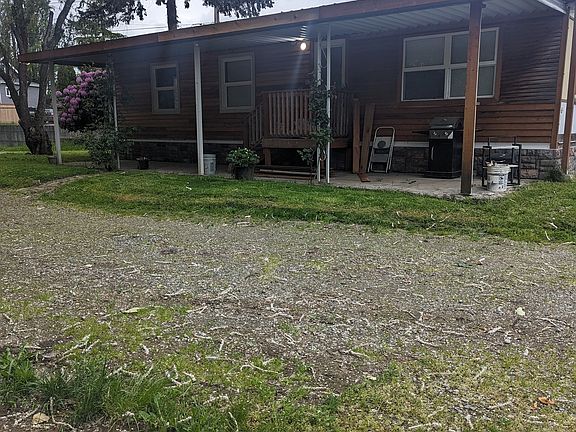 Front view with wrap around driveway