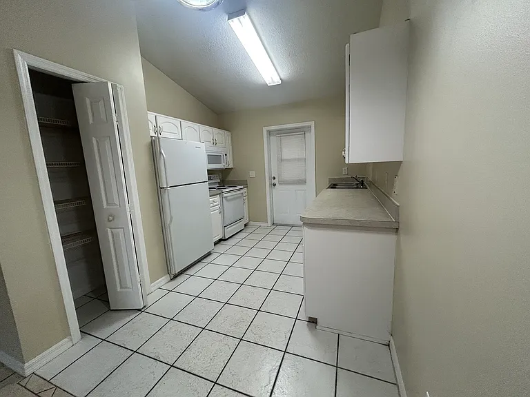 Picture of kitchen and the pantry from the dining room.