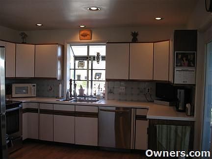 Kitchen with stainless steel applicances.