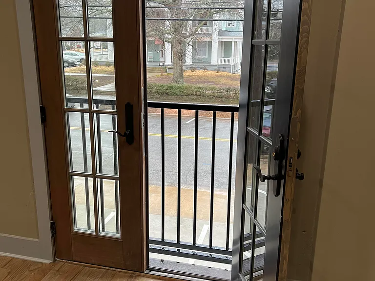 French Doors open to Bradley Street with a view of the Bradley House