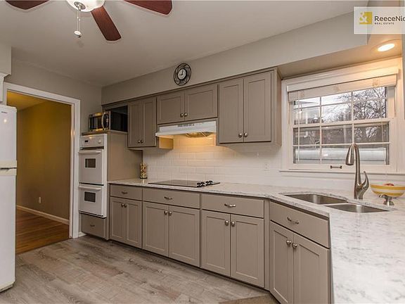 Quartz countertops, subway tile and updated cabinets